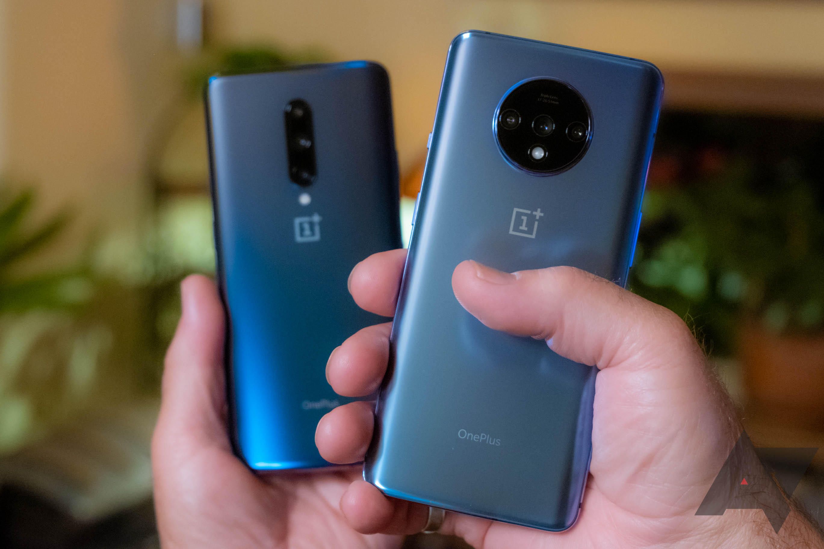 OnePlus 7T with 7 Pro in hands