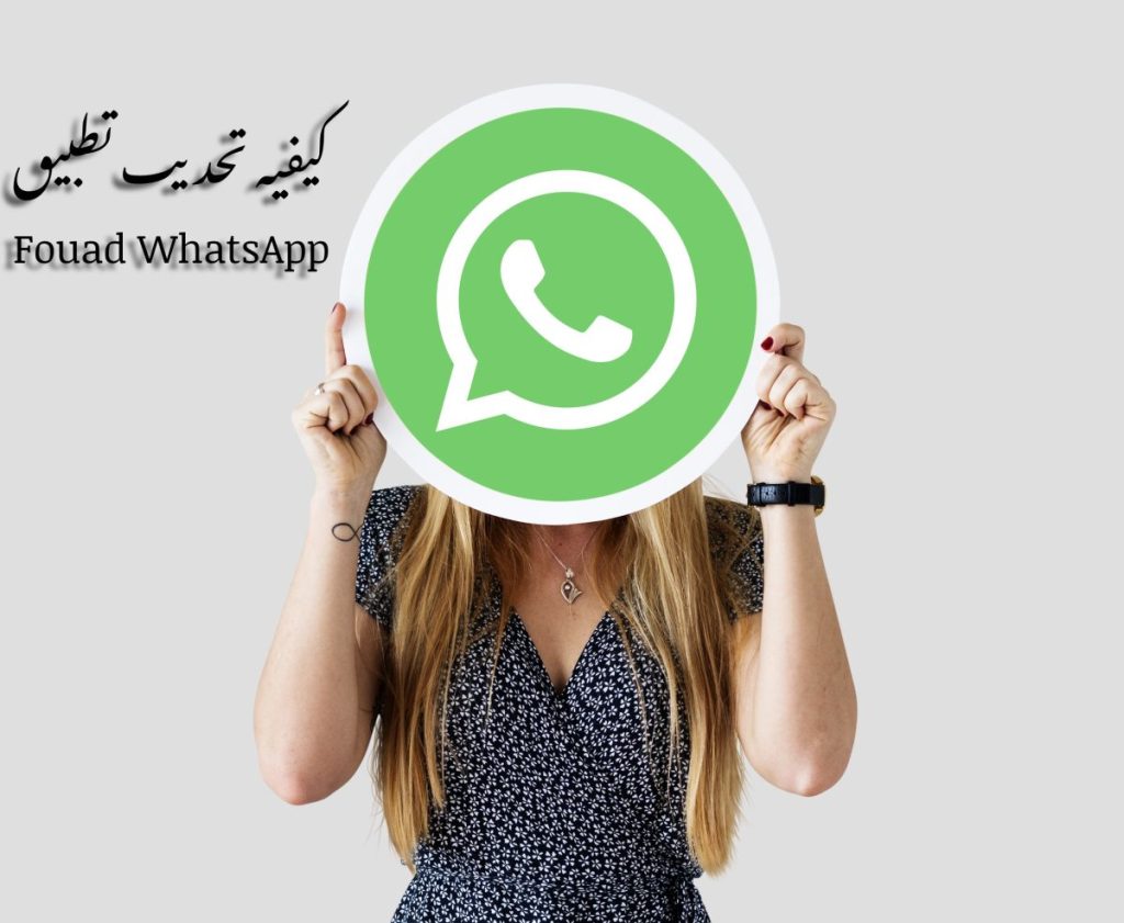 woman showing whatsapp messenger icon